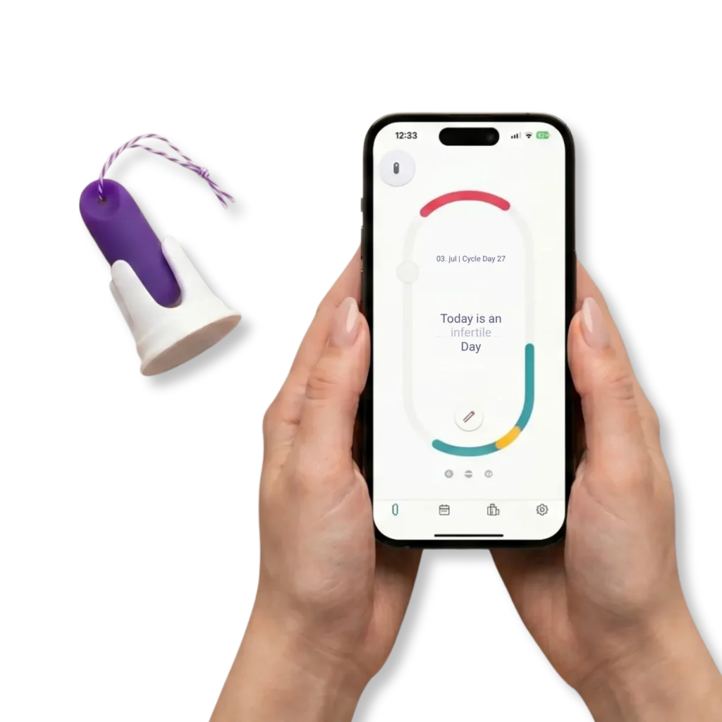 Two hands are holding a smartphone displaying the trackle app, which shows the cycle status “Today is an infertile day.” To the left of it, the purple trackle temperature sensor is visible in its white holder against a light purple background.