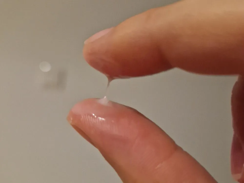 Milky cervical mucus on day 9 of the cycle