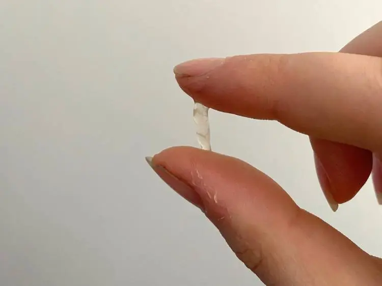 Clear, transparent cervical mucus that looks like raw egg white during fertile days; discharge that looks like egg white